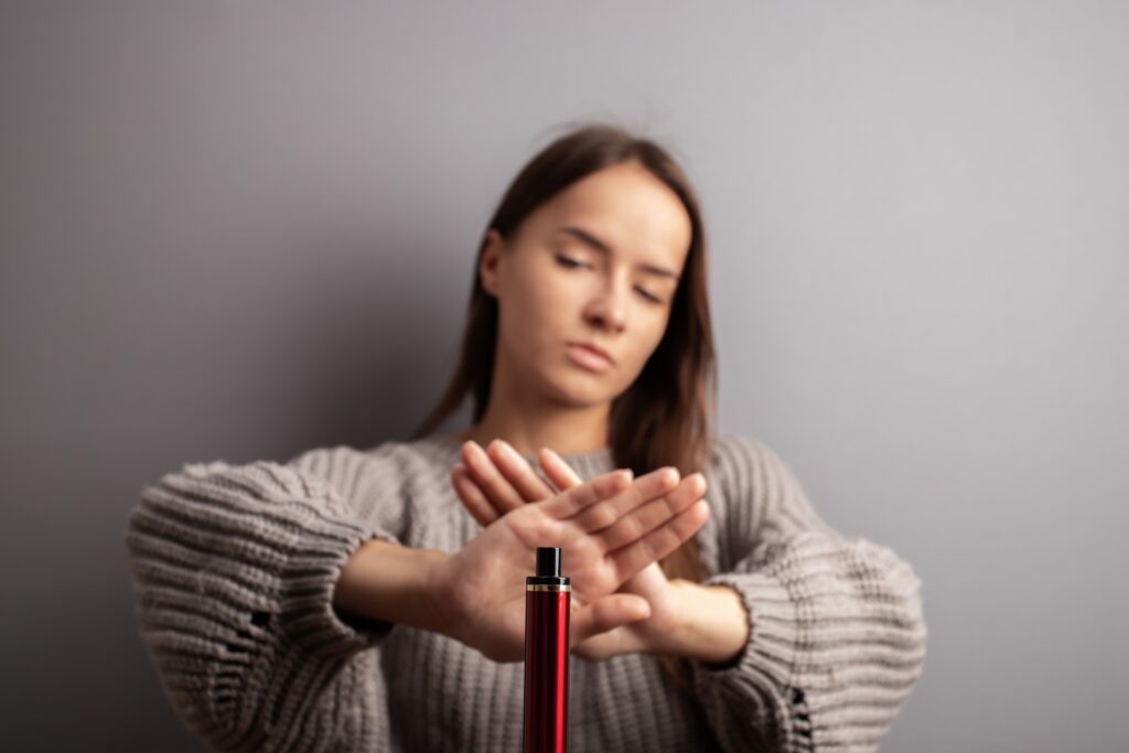 girl saying no to e-cigarettes and vaping